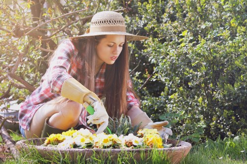 Gardeners using protective equipment while pruning and clearing